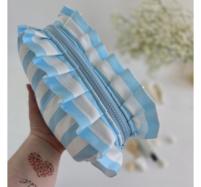 Medium sky-blue striped cosmetic bag with ruffles