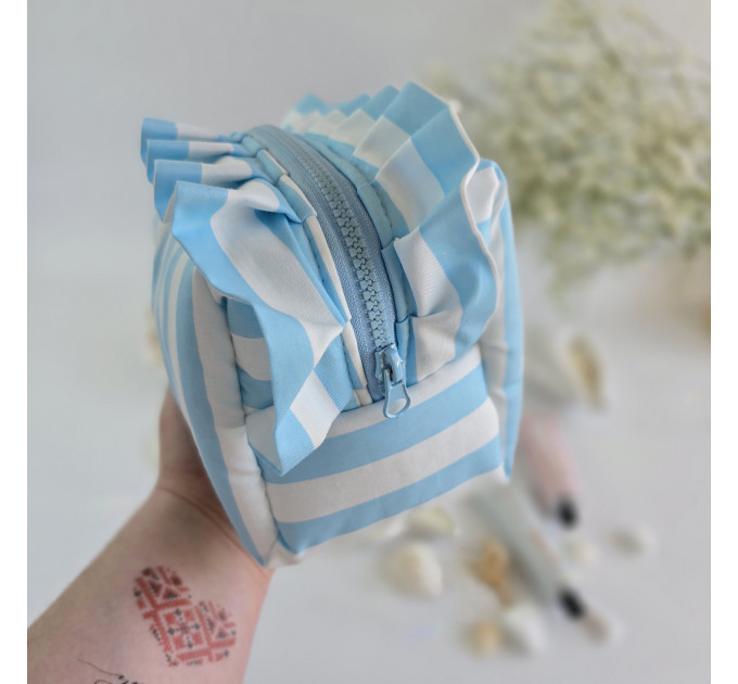 Medium sky-blue striped cosmetic bag with ruffles