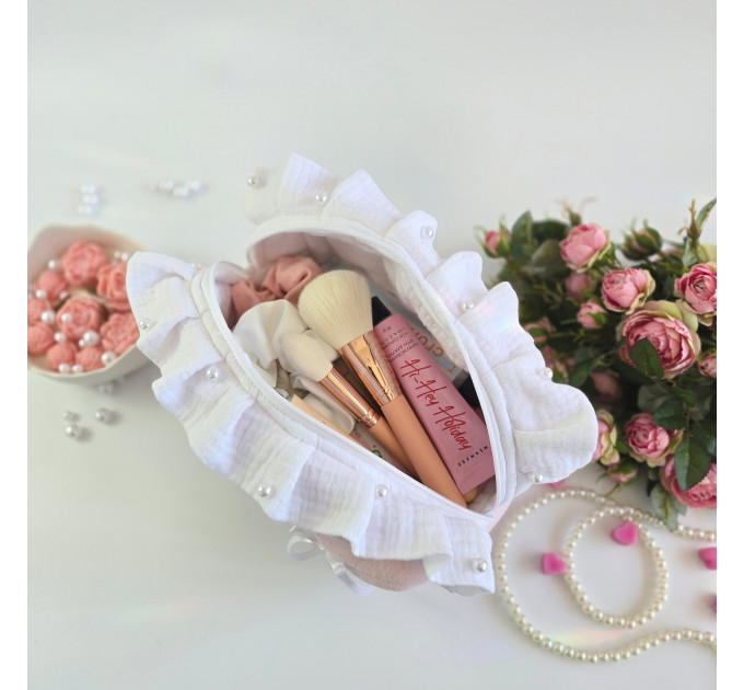 Medium soft pink cosmetic bag with ruffles, bows and pearl-like beads