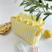 Medium yellow striped cosmetic bag with ruffles