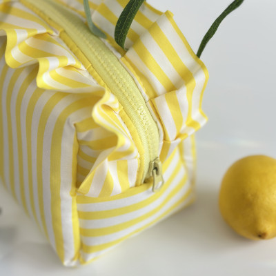 Medium yellow striped cosmetic bag with ruffles
