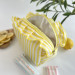 Medium yellow striped cosmetic bag with ruffles
