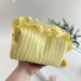 Medium yellow striped cosmetic bag with ruffles