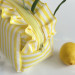 Medium yellow striped cosmetic bag with ruffles