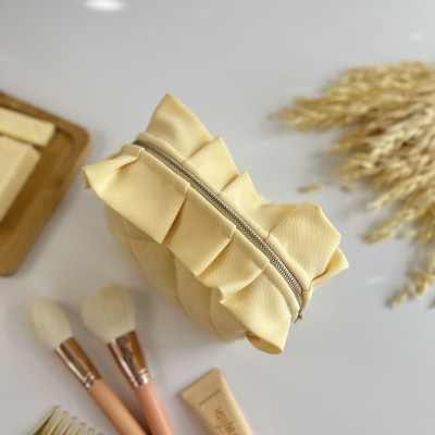 Small butter yellow cosmetic bag with ruffles