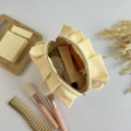 Small butter yellow cosmetic bag with ruffles