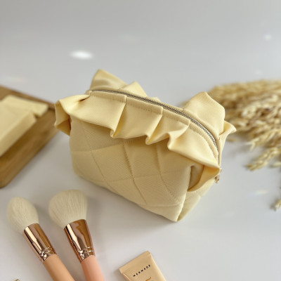 Small butter yellow cosmetic bag with ruffles