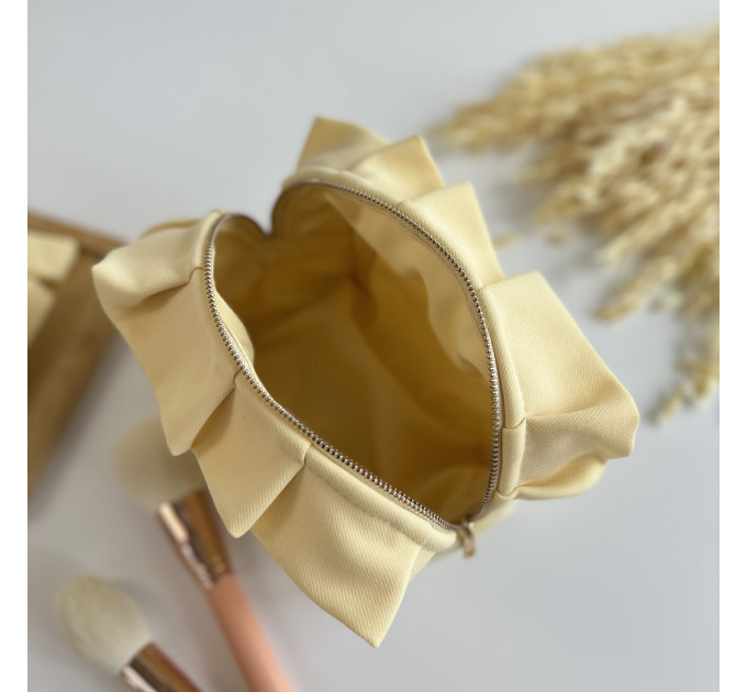 Small butter yellow cosmetic bag with ruffles