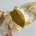 Small butter yellow cosmetic bag with ruffles