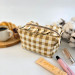 Small checkered brown cosmetic bag with ruffles
