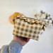 Small checkered brown cosmetic bag with ruffles