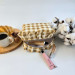 Small checkered brown cosmetic bag with ruffles