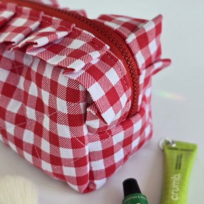 Small red gingham cosmetic bag with ruffles