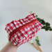 Small red gingham cosmetic bag with ruffles