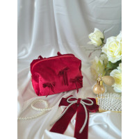 Small red velvet cosmetic bag with bows