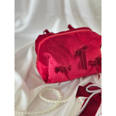 Small red velvet cosmetic bag with bows