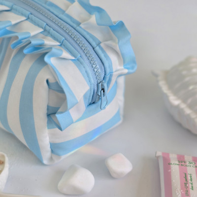 Small sky-blue striped cosmetic bag with ruffles