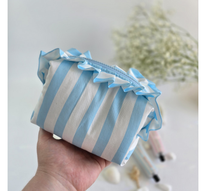 Small sky-blue striped cosmetic bag with ruffles