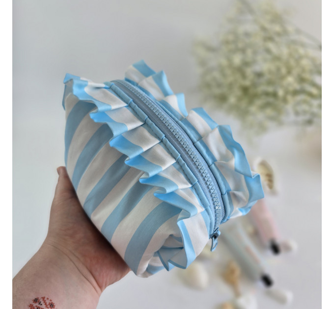 Small sky-blue striped cosmetic bag with ruffles