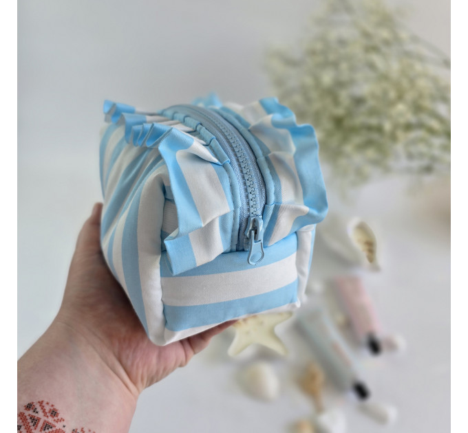 Small sky-blue striped cosmetic bag with ruffles