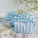Small sky-blue striped cosmetic bag with ruffles