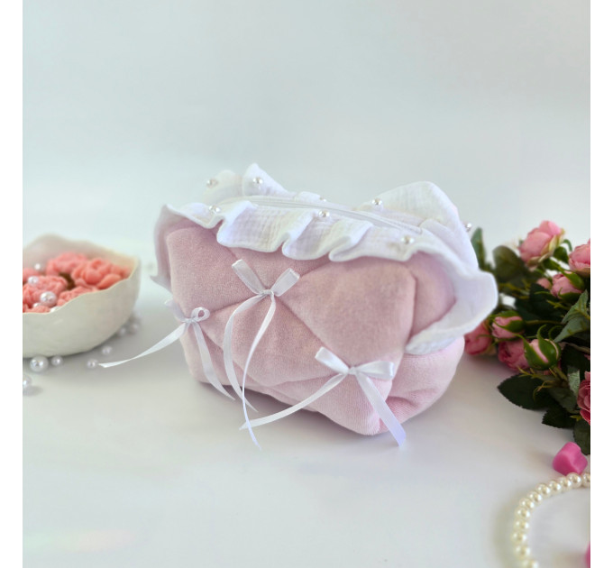 Small soft pink cosmetic bag with ruffles, bows and pearl-like beads