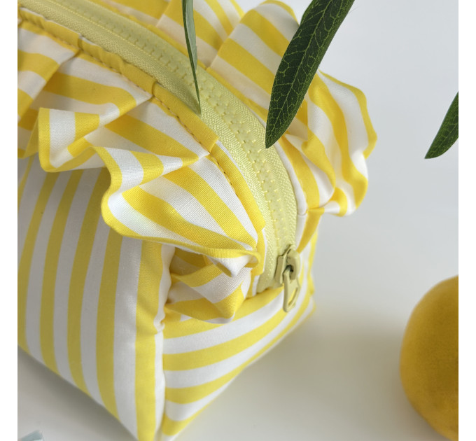 Small yellow striped cosmetic bag with ruffles