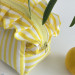Small yellow striped cosmetic bag with ruffles
