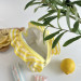 Small yellow striped cosmetic bag with ruffles
