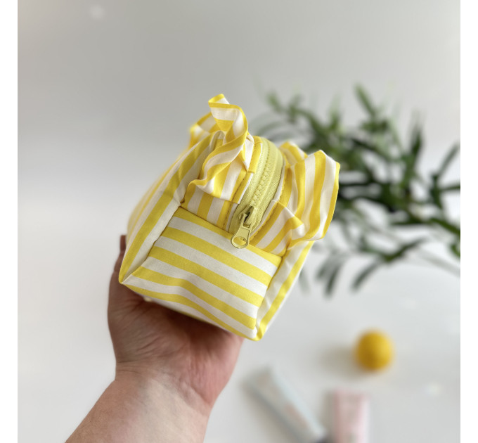 Small yellow striped cosmetic bag with ruffles