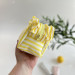 Small yellow striped cosmetic bag with ruffles